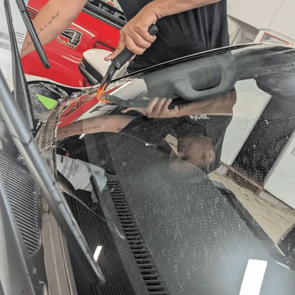 windshield protection film being installed on Edmonton vehicle